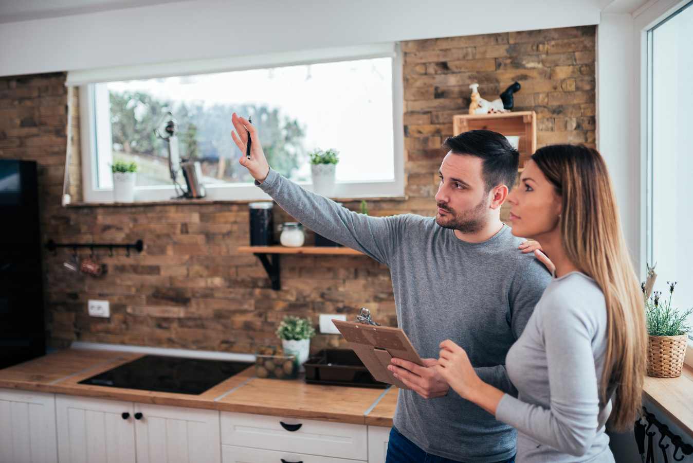 Homeowners discussing their home renovation plans.