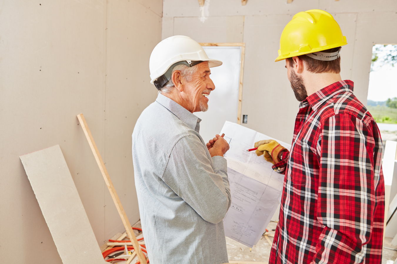 Contractors discussion home renovation project.