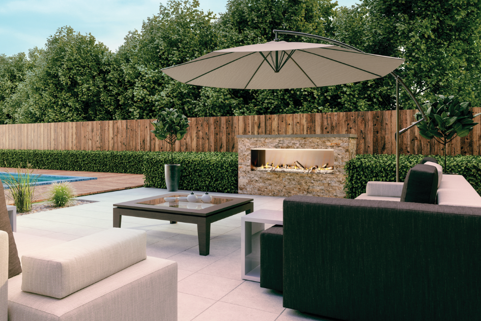 A backyard patio set situated around the Napoleon Galaxy see-thru outdoor fireplace