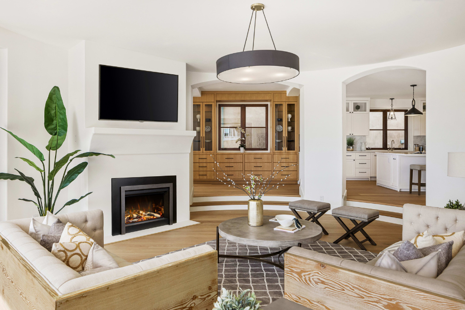 A living room with an updated fireplace as the focal point